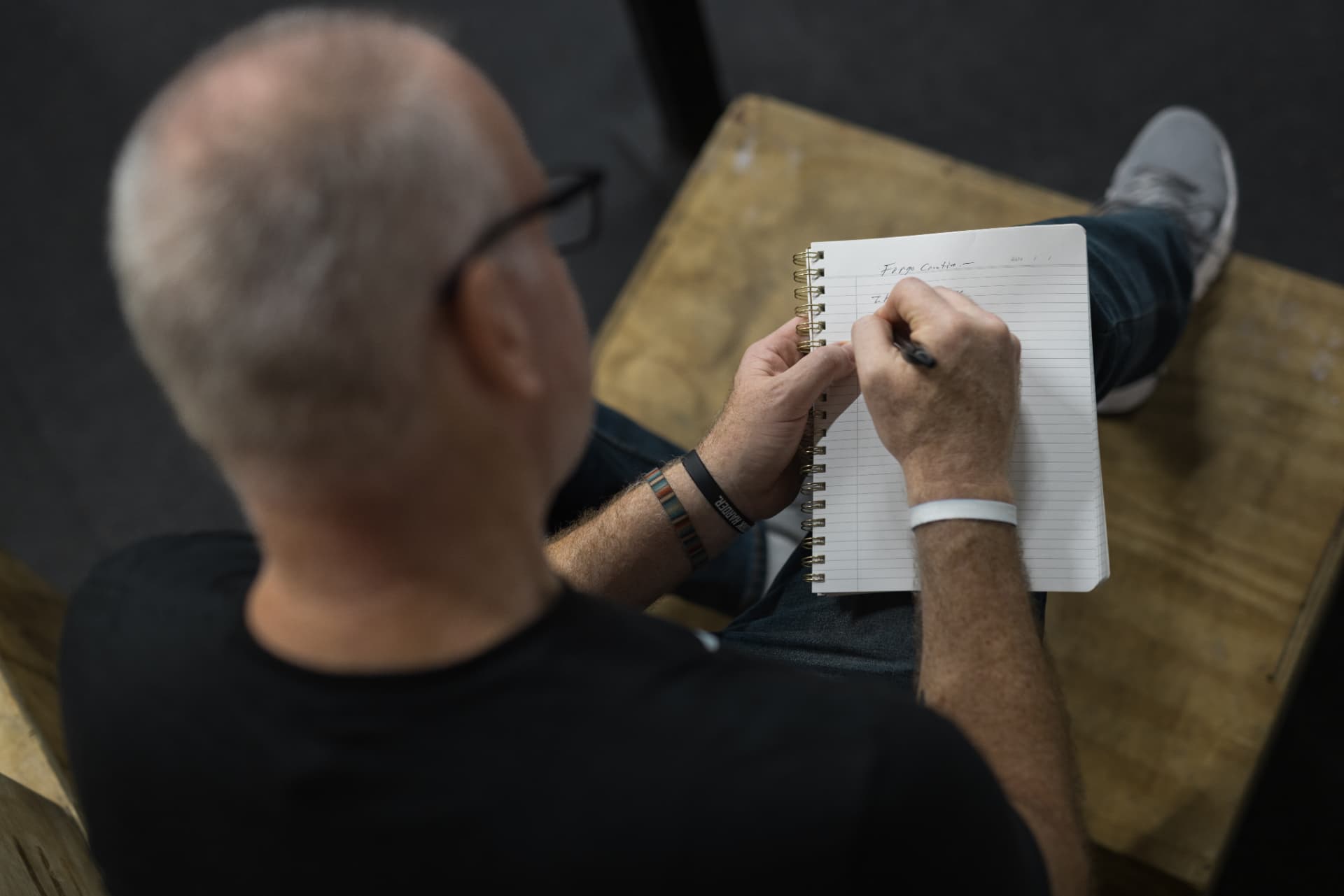 Jeff Mason sketching ideas in a notebook