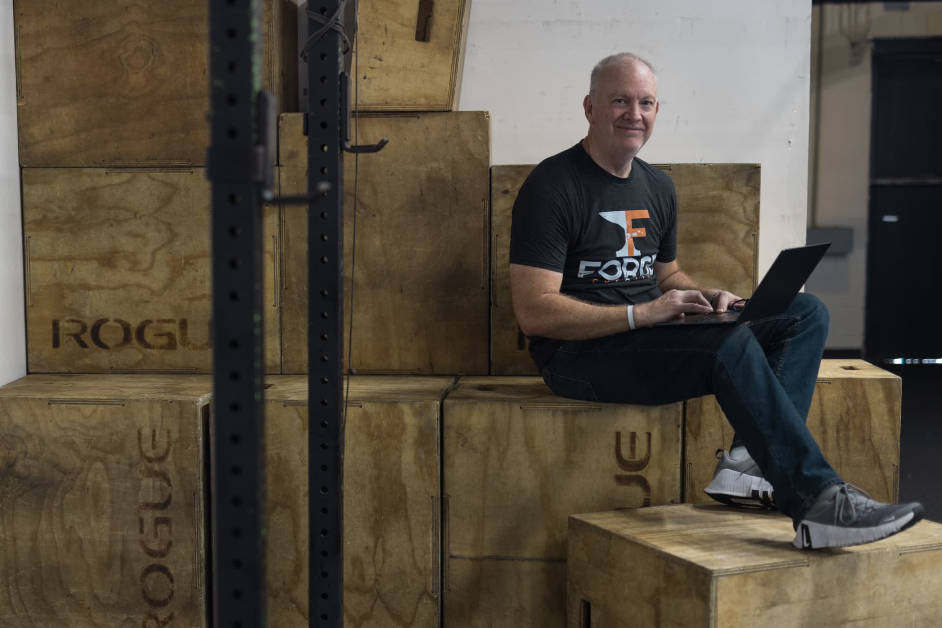 Jeff Mason working on a laptop in the studio